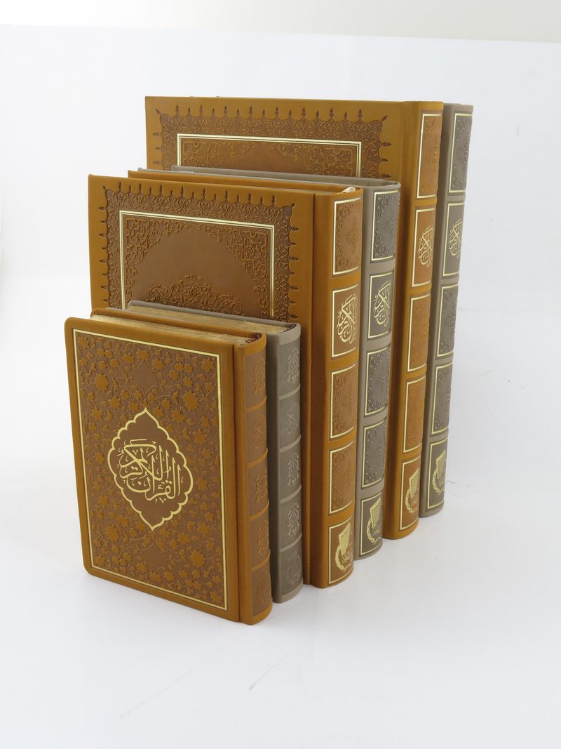 A graduated series of embossed leather bindings in ascending sizes
