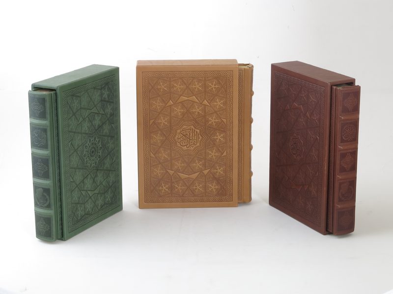 Three genuine-leather bindings in green, tan and maroon