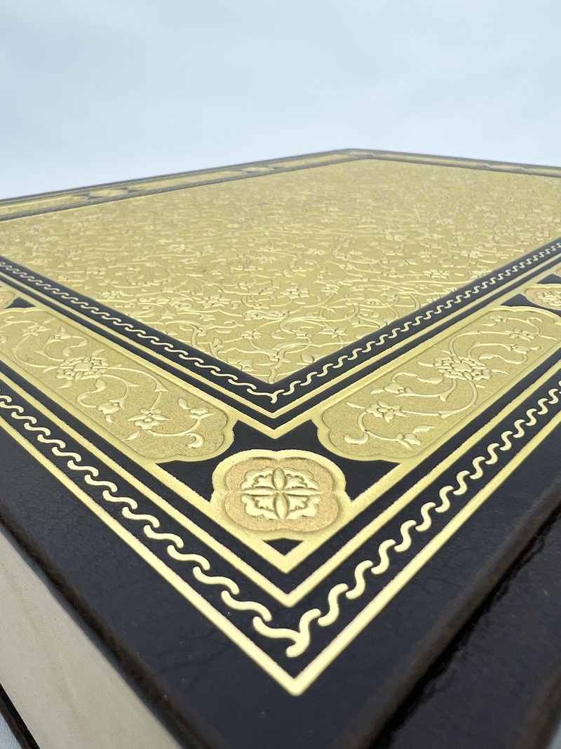 Close-up of a hot-foil tooled cover in gold and black