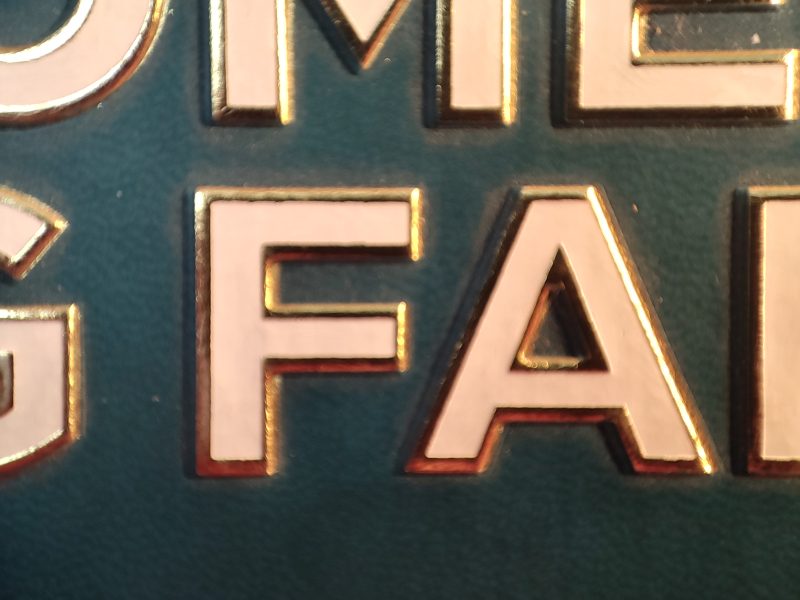 Macro of gold hot-foil over dense Islimi tooling