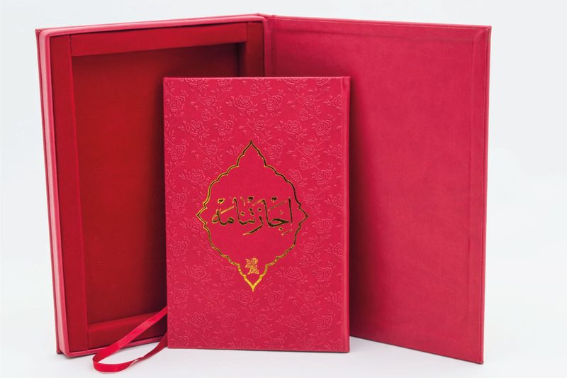Red thermo-leather volume in a presentation box with velvet interior
